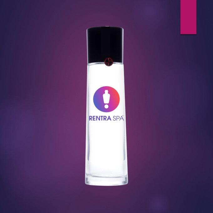 Clear cosmetic glass bottle with black cap on purple gradient background