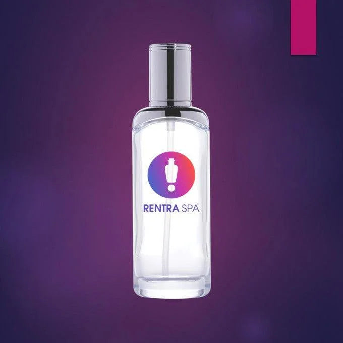 Clear cosmetic glass spray bottle with pump dispenser on purple background