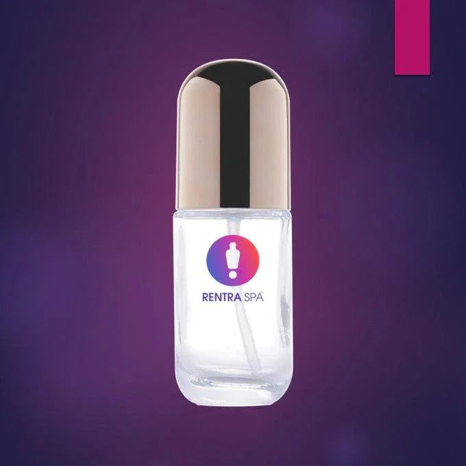 Clear glass cosmetic bottle with gold cap and applicator, ideal for beauty packaging