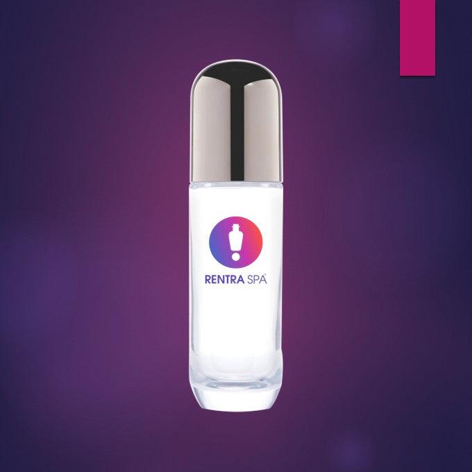 Clear cosmetic glass bottle with metallic cap on purple background, ideal for skincare or serum packaging.