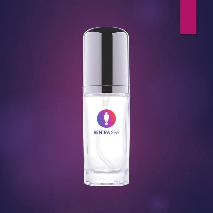 Clear glass cosmetic pump bottle with silver cap and RENTRA SPA logo on a purple background
