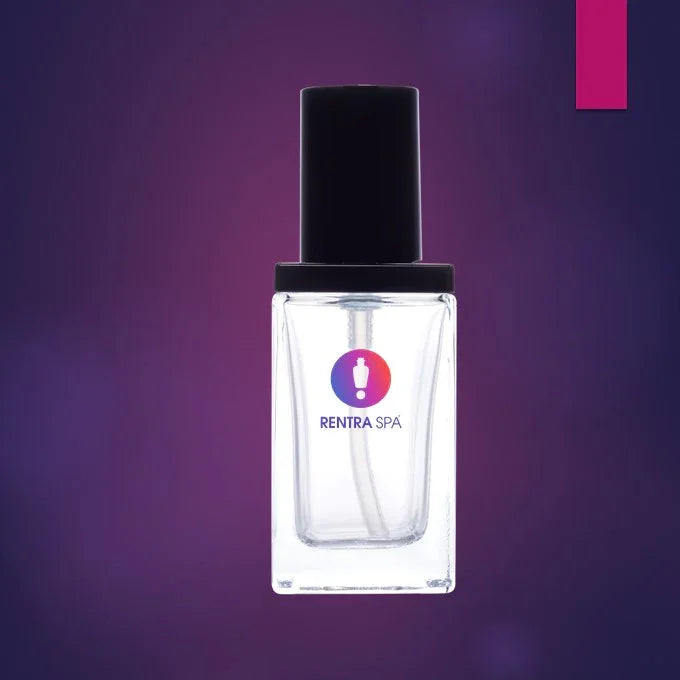 Clear square glass cosmetic bottle with black cap on purple background