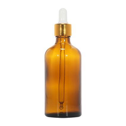 Amber glass dropper bottle with gold cap for cosmetic packaging