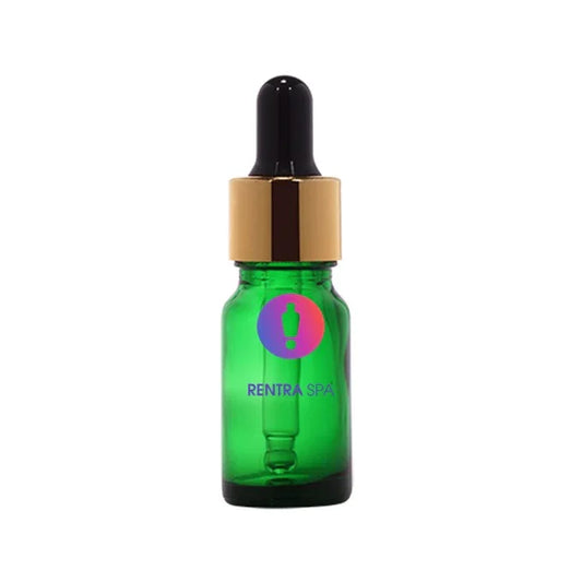 Green glass dropper bottle with gold cap and black pipette for cosmetic packaging