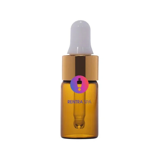 Amber glass dropper bottle with gold cap and white pipette for cosmetic packaging