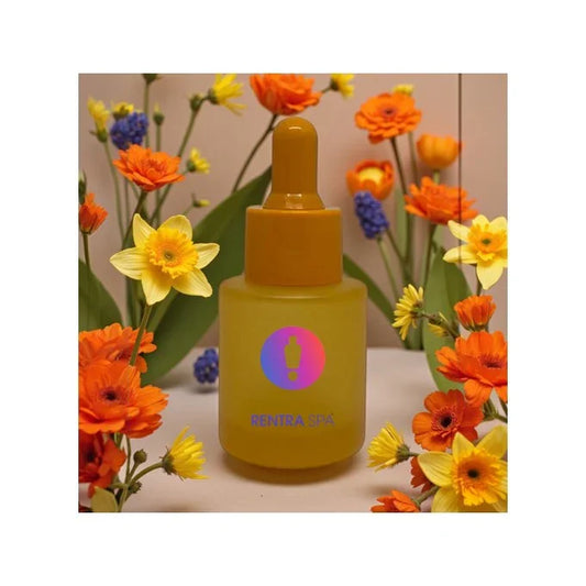 Yellow cosmetic glass dropper bottle with colorful logo, surrounded by orange and yellow flowers