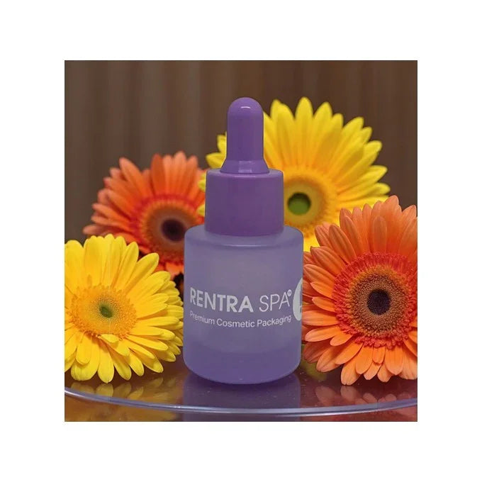 Purple cosmetic glass dropper bottle with RENTRA SPA logo, surrounded by orange and yellow flowers