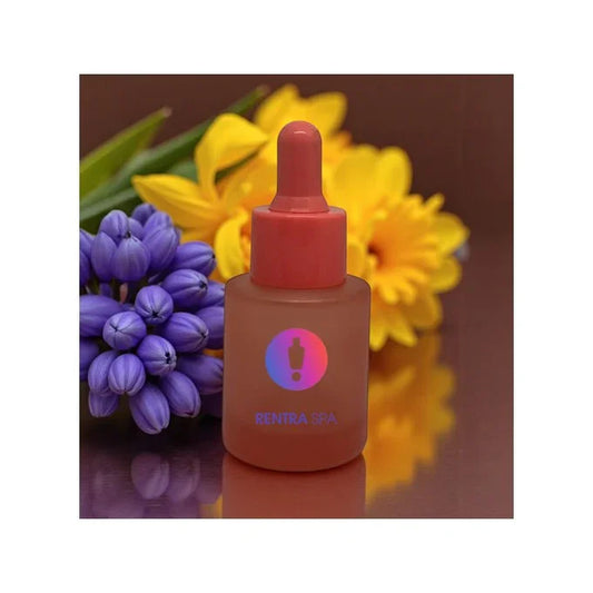 Frosted glass dropper bottle with red cap for cosmetic packaging, flowers in background
