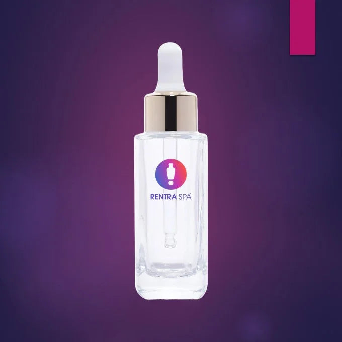 Clear square glass dropper bottle with gold cap for cosmetic serum on purple background