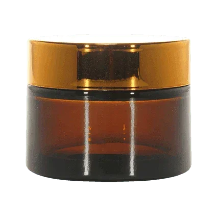 Amber glass cosmetic jar with shiny gold screw cap, ideal for skincare or cream packaging