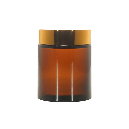 Amber glass cosmetic jar with shiny gold lid for skincare or beauty products