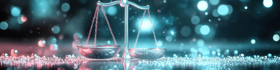 Shiny silver balance scale on glittering surface with blue and pink bokeh lights