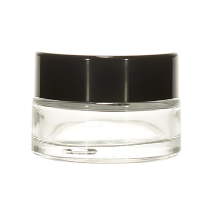 Clear cosmetic glass jar with black lid, ideal for cream or balm packaging