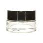 Clear cosmetic glass jar with black lid, ideal for cream or balm packaging