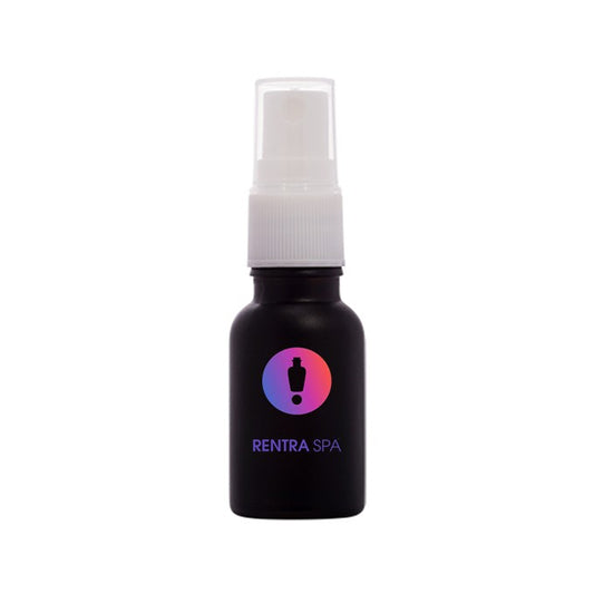 Matte black cosmetic glass spray bottle with white pump and colorful logo, used for packaging.