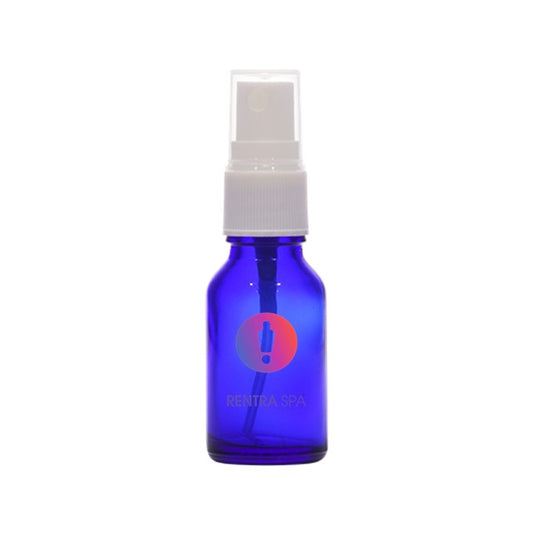 Blue glass spray bottle with white pump, ideal for cosmetic packaging