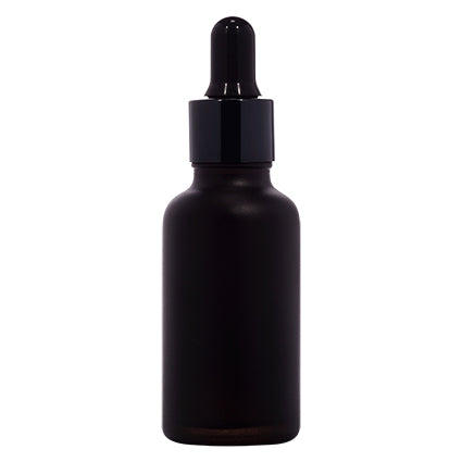 Black glass dropper bottle for cosmetic liquid packaging, plain background