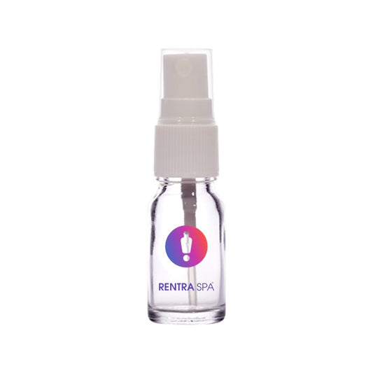 Clear glass spray bottle with white atomizer cap for cosmetic packaging