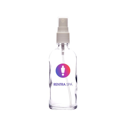 Clear cosmetic glass spray bottle with white pump and RENTRASPA™ logo