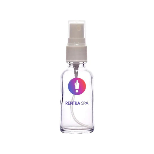 Clear cosmetic glass spray bottle with white pump and RENTRASPA™ logo, ideal for packaging.