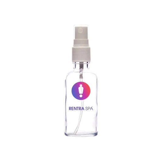 Clear cosmetic glass spray bottle with white plastic pump and multicolor label