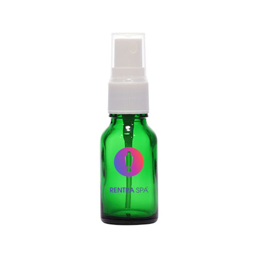 Green glass cosmetic spray bottle with white plastic pump and cap