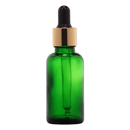 Green glass dropper bottle with gold collar for cosmetic packaging