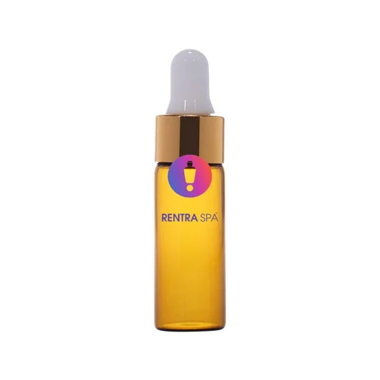 Amber glass dropper bottle with gold cap and white pipette for cosmetic packaging