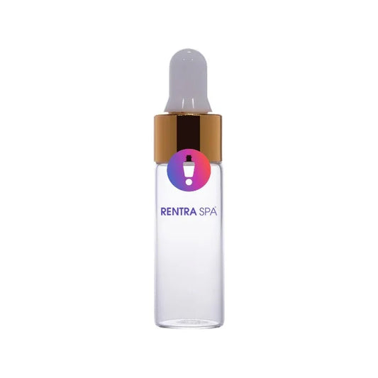 Clear glass dropper bottle with gold cap and white rubber bulb for cosmetic packaging
