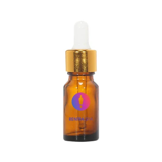 Amber glass dropper bottle with gold cap and white pipette for cosmetic packaging