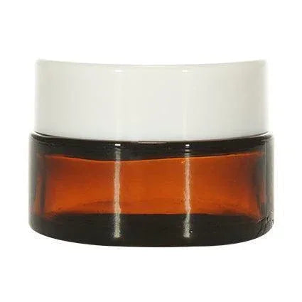 Amber glass cosmetic jar with white lid, ideal for skincare or sample packaging