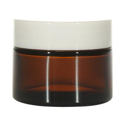 Amber glass cosmetic jar with white lid, ideal for beauty cream or skincare packaging