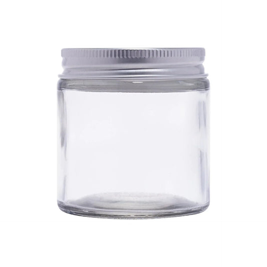Clear round glass cosmetic jar with silver screw cap, ideal for skincare packaging